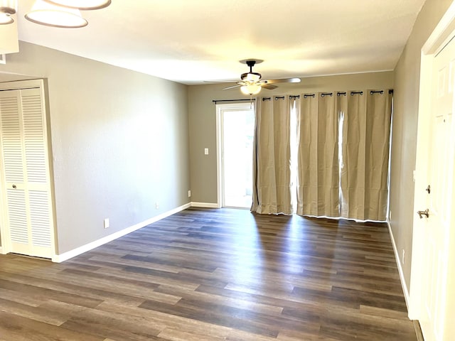 1548 SE Royal Green Cir Unit 105, Port Saint Lucie, FL 34952 - empty room featuring ceiling fan, wood finished floors, and baseboards