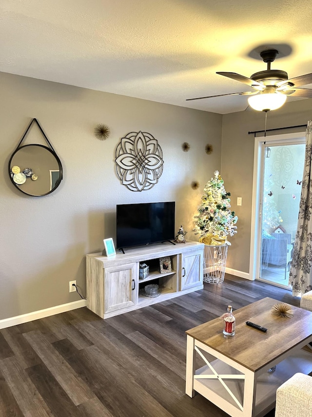 1548 SE Royal Green Cir Unit 105, Port Saint Lucie, FL 34952 - living room featuring dark wood-style flooring, baseboards, and a ceiling fan