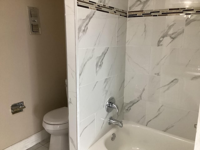 bathroom featuring shower / bathtub combination, toilet, and baseboards