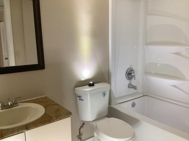 full bath with washtub / shower combination, vanity, and toilet