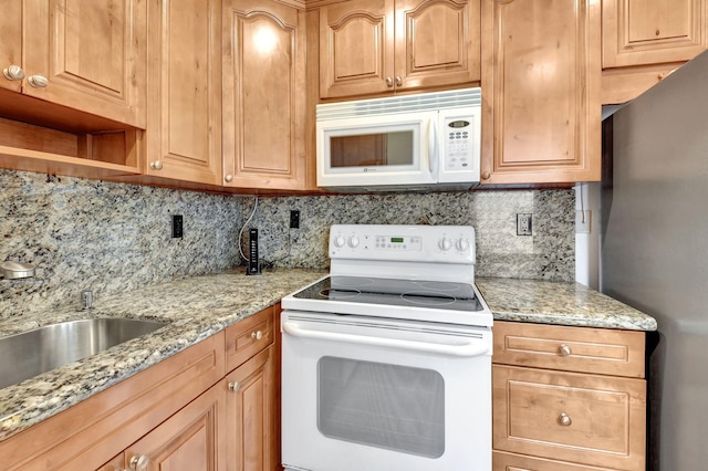 kitchen with open shelves, tasteful backsplash, a sink, light stone countertops, and white appliances