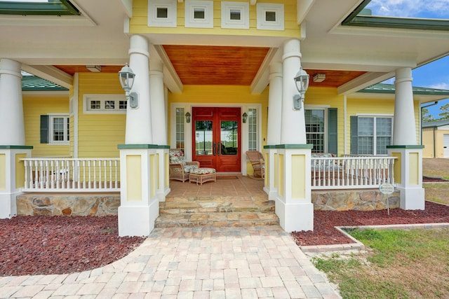 property entrance with french doors and a porch