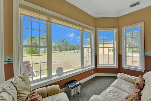 sunroom / solarium featuring visible vents and a healthy amount of sunlight