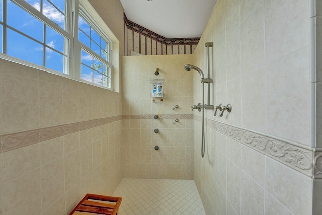 bathroom with a tile shower