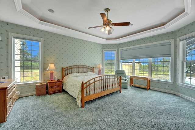 bedroom with baseboards, a raised ceiling, light colored carpet, and wallpapered walls