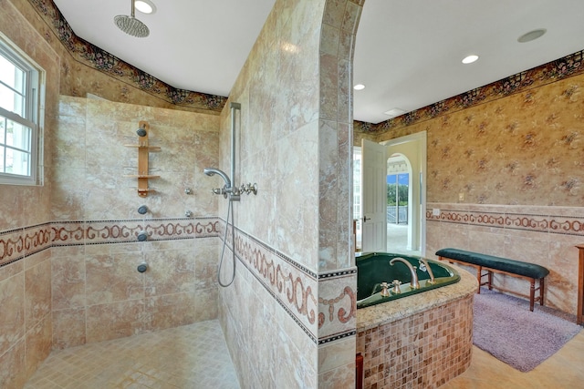 bathroom featuring tile patterned floors, a garden tub, walk in shower, tile walls, and recessed lighting