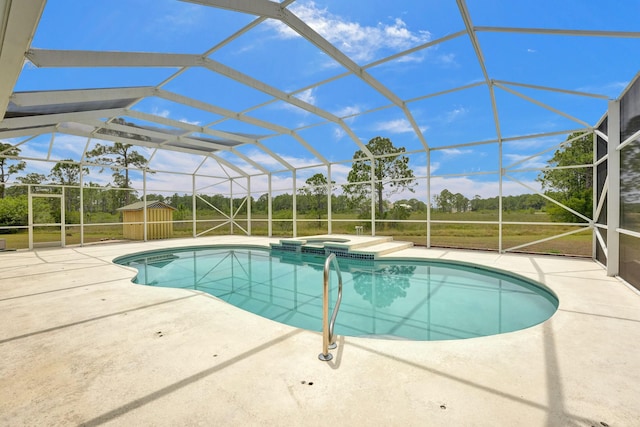 view of pool with a lawn, a patio area, a lanai, and a pool with connected hot tub