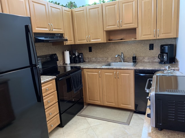 kitchen with under cabinet range hood, light countertops, black appliances, open shelves, and a sink