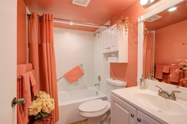 full bathroom with toilet, visible vents, shower / bath combination with curtain, and vanity