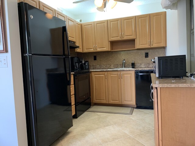 750 Burgundy P, Delray Beach, FL 33484 - kitchen featuring black appliances, under cabinet range hood, light brown cabinets, ceiling fan, and light tile patterned flooring