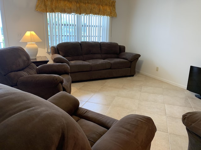 750 Burgundy P, Delray Beach, FL 33484 - living area with tile patterned flooring, healthy amount of natural light, and baseboards