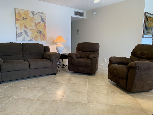 750 Burgundy P, Delray Beach, FL 33484 - living room with a textured ceiling and light tile patterned flooring