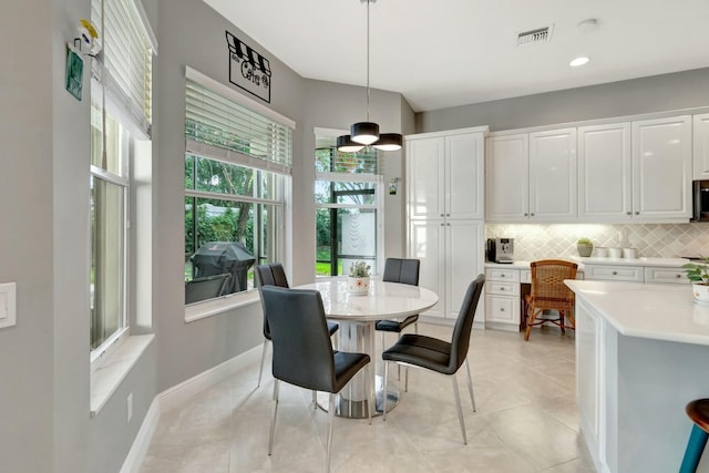 dining room with light tile patterned floors, recessed lighting, visible vents, and baseboards