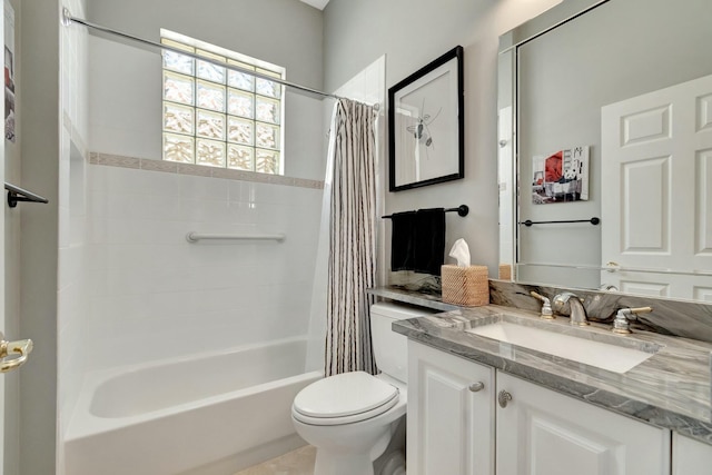 bathroom with toilet, shower / tub combo, and vanity