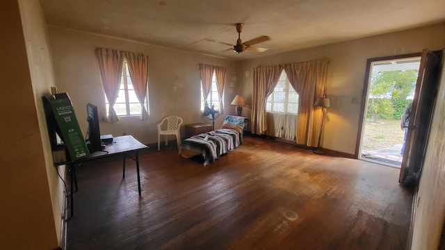 sitting room with a healthy amount of sunlight, ceiling fan, and wood finished floors