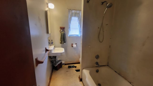 full bathroom featuring bathing tub / shower combination and baseboards