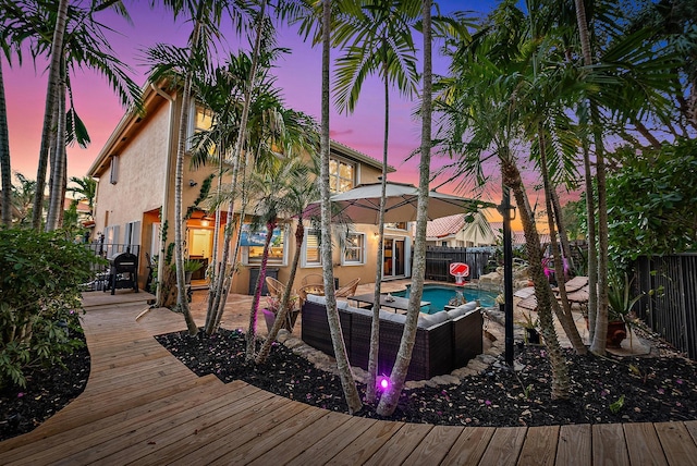 exterior space with a fenced in pool, a fenced backyard, and outdoor lounge area