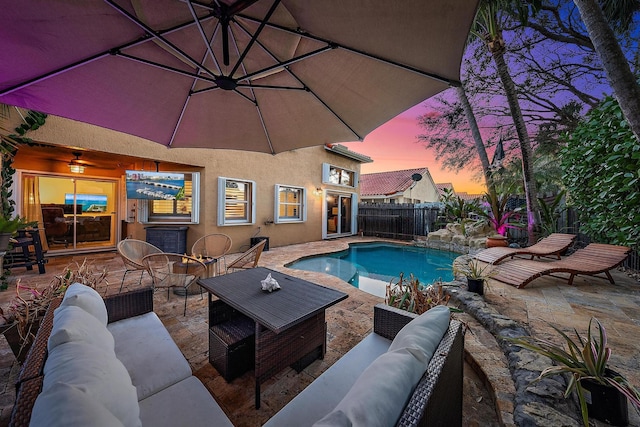 view of pool with a patio area, fence, an outdoor hangout area, and a fenced in pool