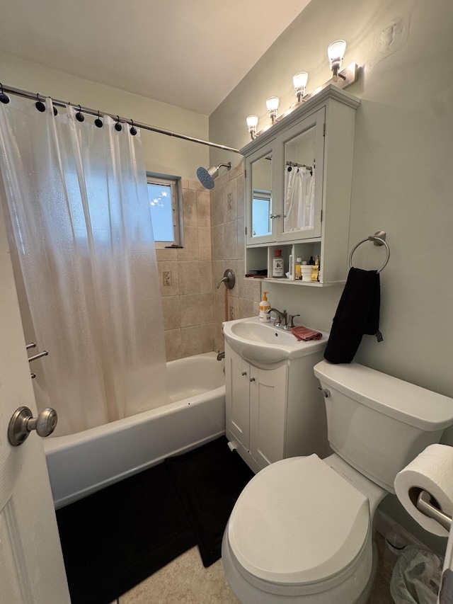 bathroom featuring toilet, shower / bath combo with shower curtain, and vanity