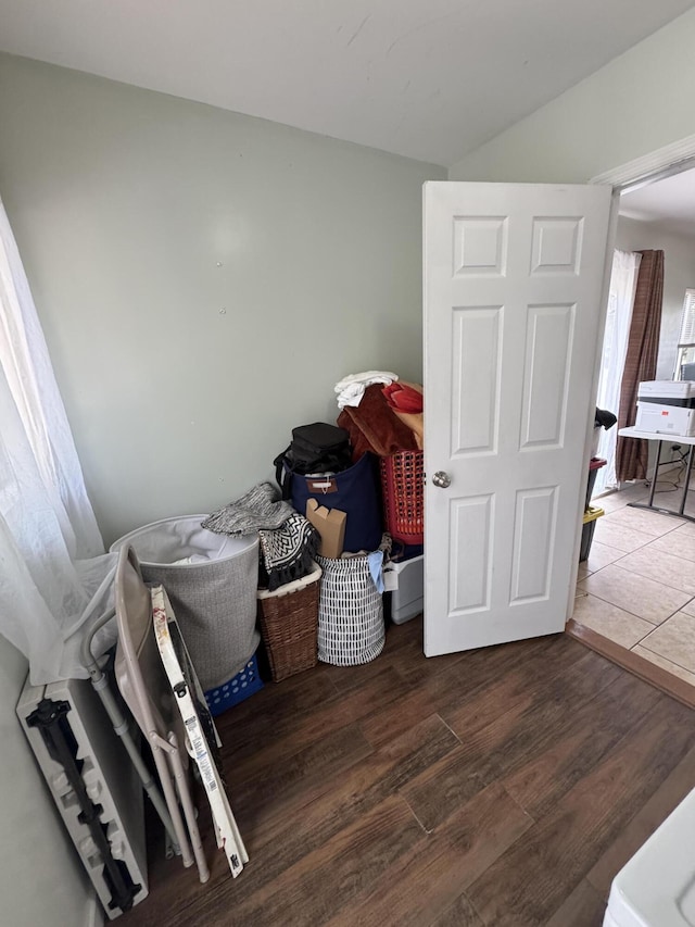 interior space with lofted ceiling and wood finished floors