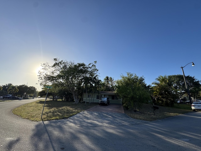 obstructed view of property with driveway