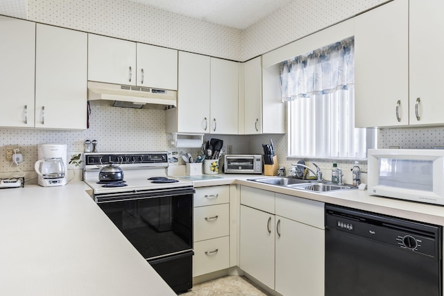 kitchen featuring black dishwasher, range with electric cooktop, white microwave, under cabinet range hood, and a sink