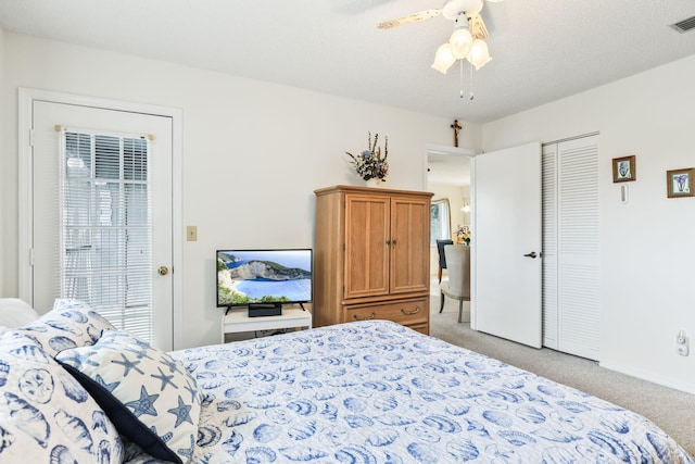 bedroom with light carpet, ceiling fan, multiple windows, and visible vents