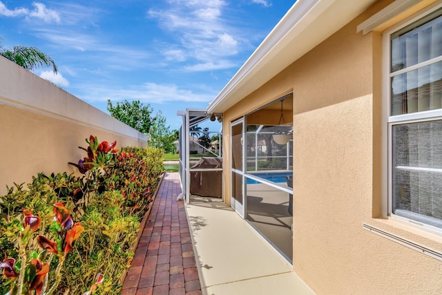 exterior space with glass enclosure and fence