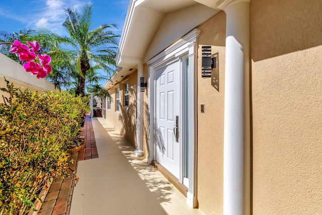 view of side of home featuring stucco siding