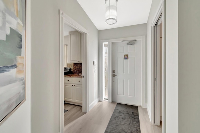 foyer featuring light wood finished floors