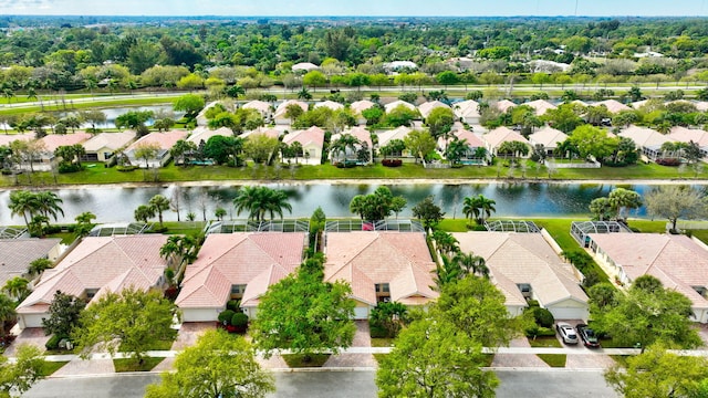 bird's eye view featuring a residential view and a water view