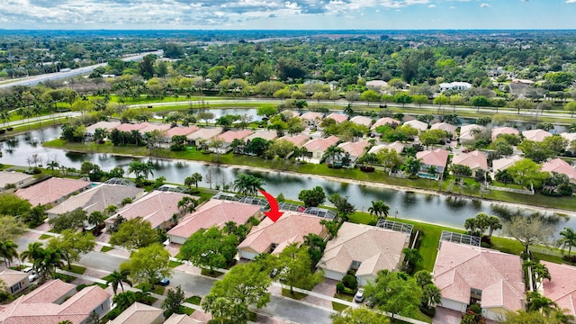 bird's eye view featuring a water view and a residential view