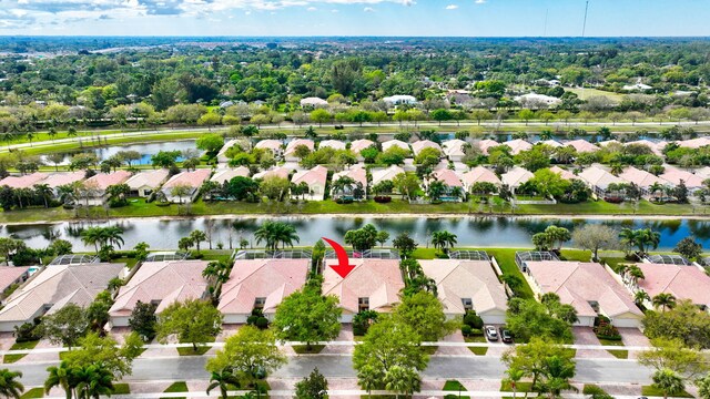 birds eye view of property with a water view and a residential view