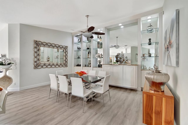 dining room with light wood finished floors, recessed lighting, a ceiling fan, and baseboards