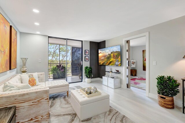 living room with expansive windows and recessed lighting