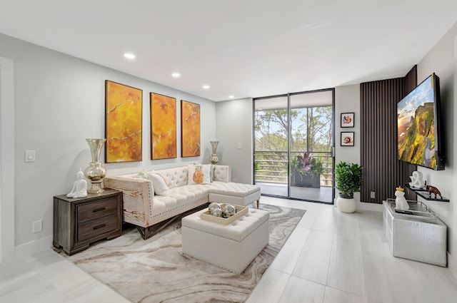tiled living room featuring floor to ceiling windows, baseboards, and recessed lighting