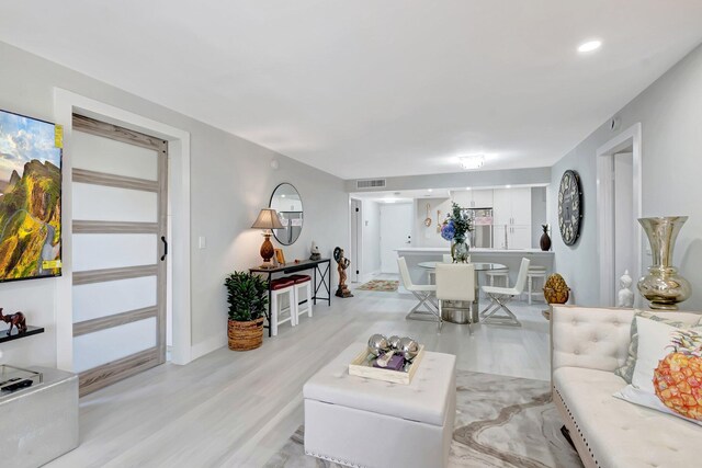 interior space with a textured ceiling and baseboards