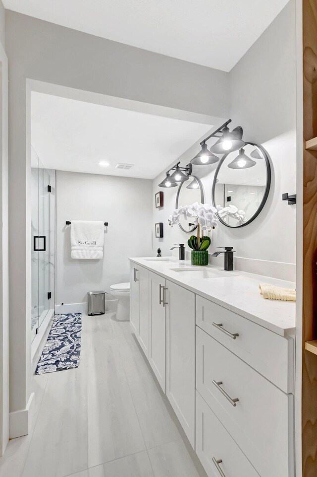 full bathroom with baseboards and a marble finish shower