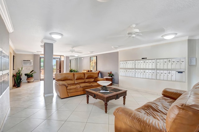 living area with light tile patterned floors, baseboards, ceiling fan, ornamental molding, and mail area