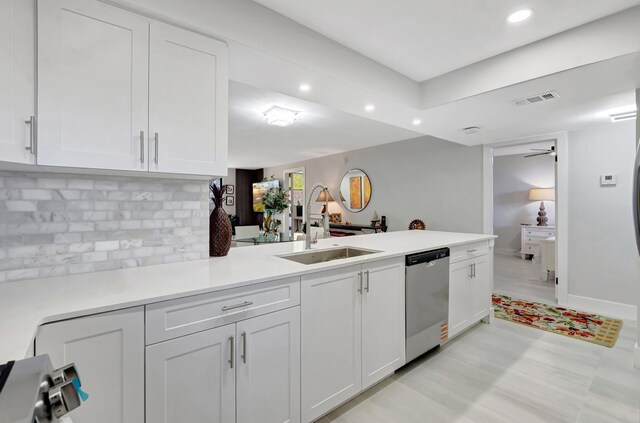 kitchen with a sink, visible vents, baseboards, white cabinets, and appliances with stainless steel finishes