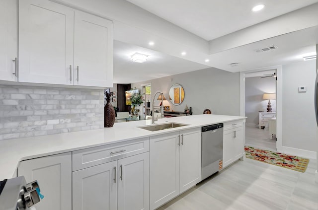 kitchen with white cabinetry, visible vents, a sink, and dishwasher