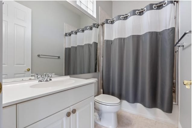 bathroom with toilet, tile patterned flooring, shower / bath combo with shower curtain, and vanity