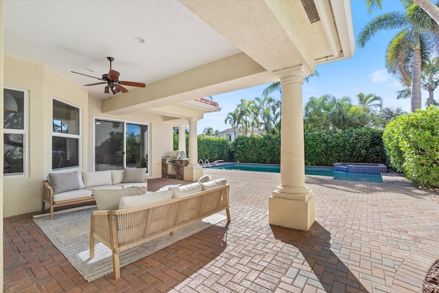 view of patio / terrace featuring a pool with connected hot tub, outdoor lounge area, ceiling fan, and area for grilling