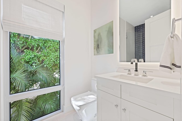 full bath with toilet and vanity