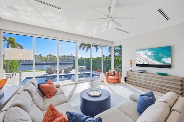 living room featuring visible vents, ceiling fan, and wood finished floors