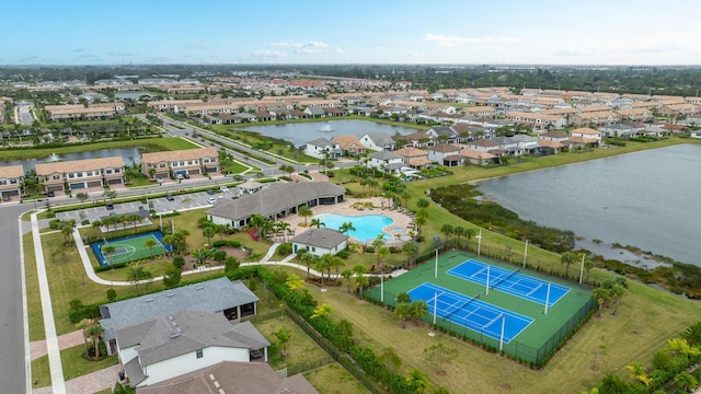 drone / aerial view with a residential view and a water view