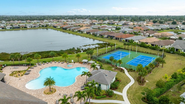 birds eye view of property with a water view and a residential view