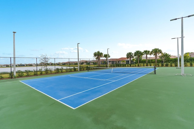 view of sport court with fence