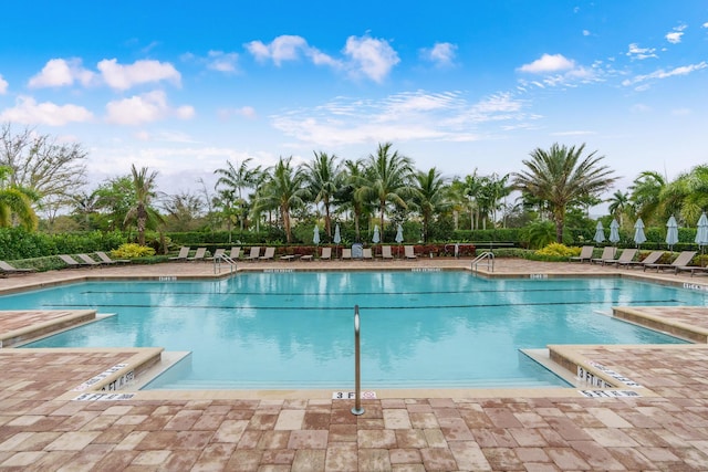 community pool featuring a patio area