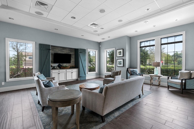 living room with dark wood-style flooring, recessed lighting, visible vents, and baseboards